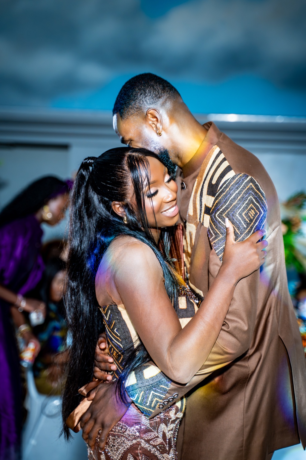 A couple embracing during their celebration